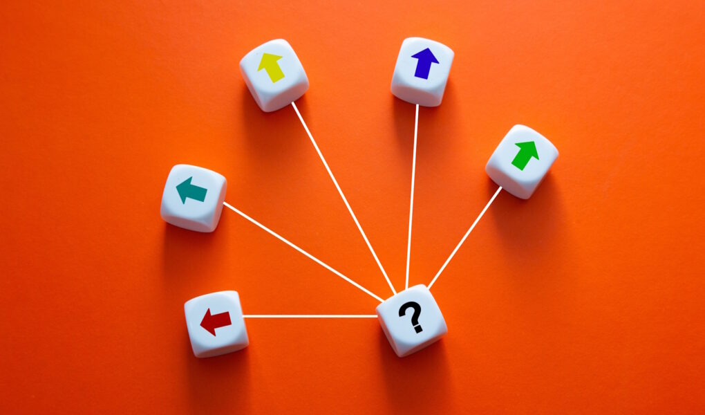 Question mark dice central to multiple choices
